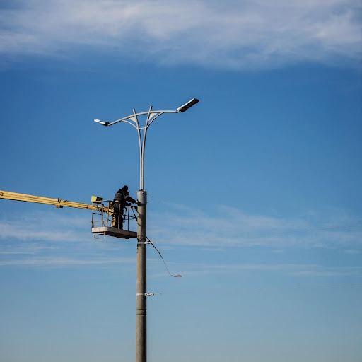 Worker Installing Street Light